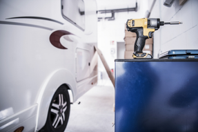 RV in shop showing a drill to get repaired