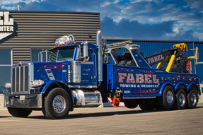 Fabel Tow Truck outside on a sunny day in front of the Collision Center